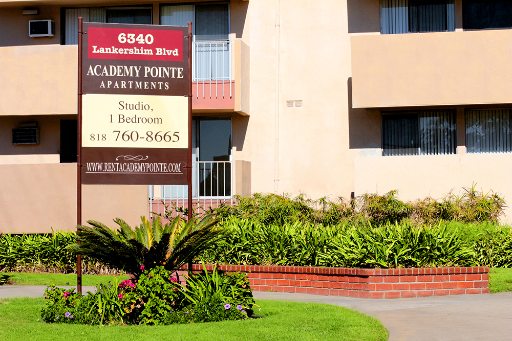 This image displays entrance marker photo of Academy Pointe Apartments