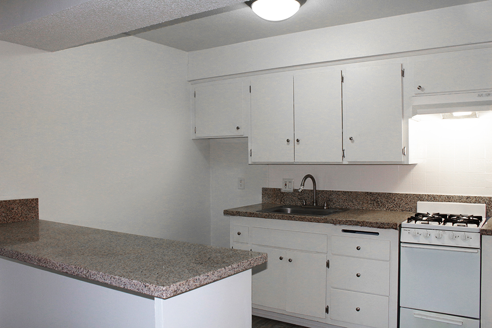 This photo is the visual representation of gourmet kitchens at Academy Pointe Apartments.